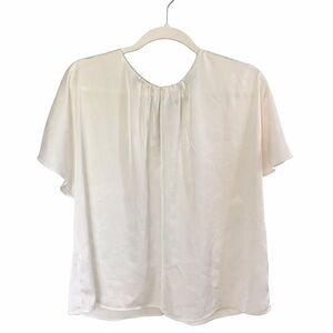 Banana Republic champagne color satin Blouse. machine wash warm Tumble dry low.